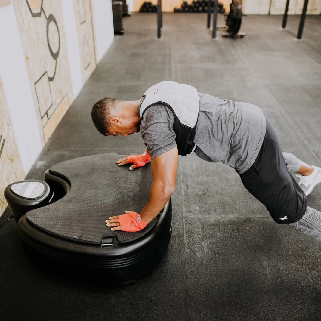 Person using a Power Plate pro5HP in studio